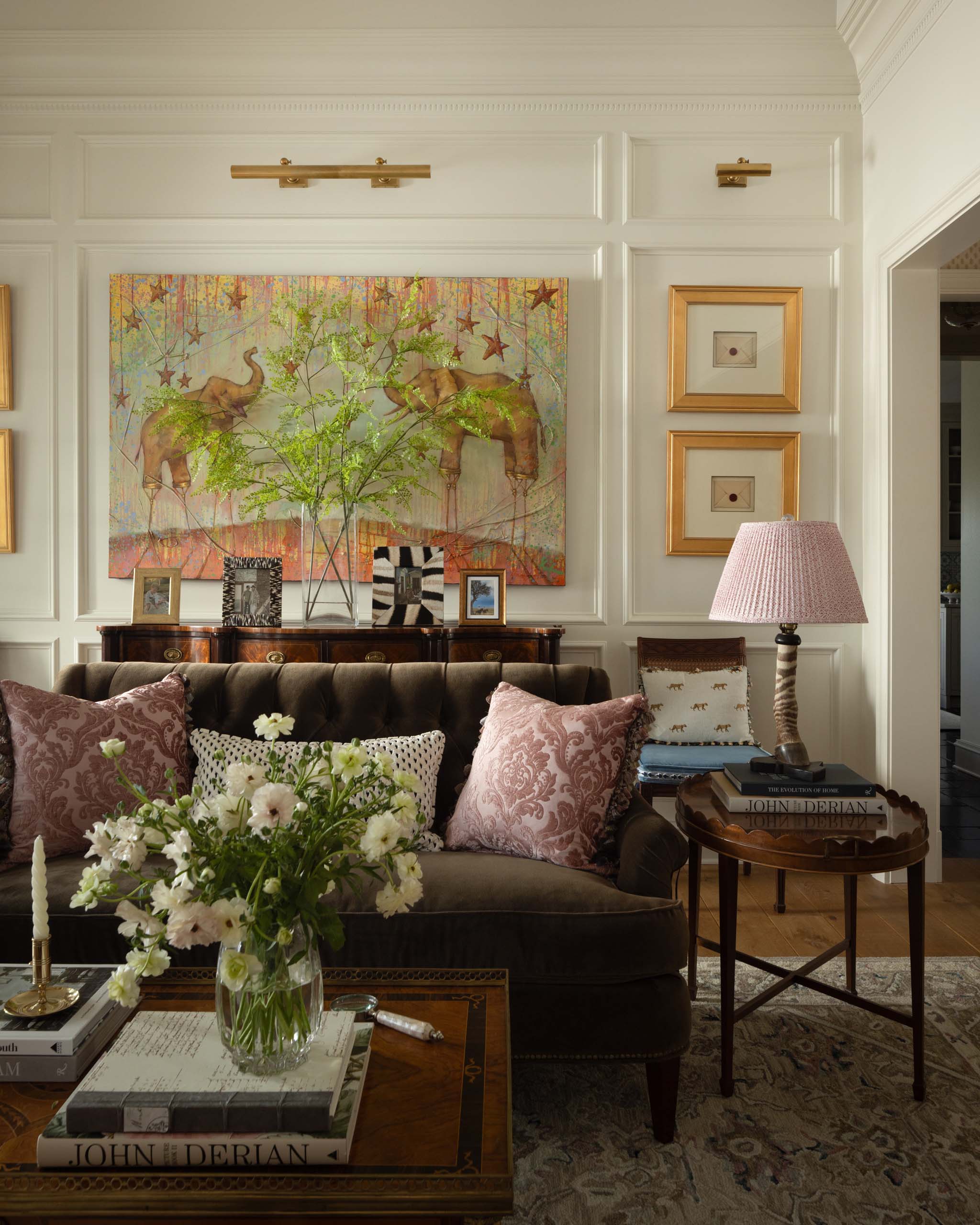 Traditional English living room with custom millwork and statement artwork