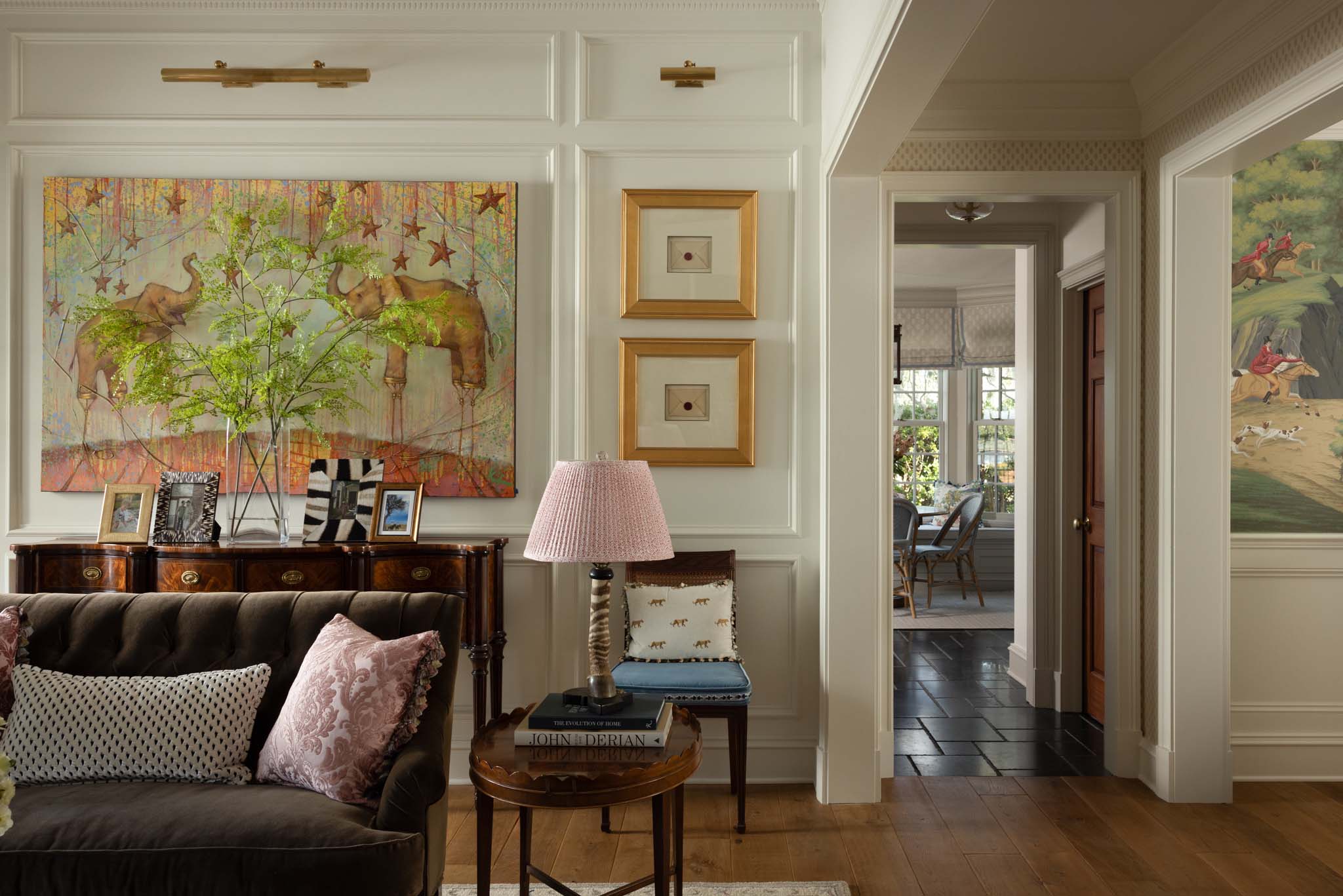English-inspired living room with custom paneling and fine art