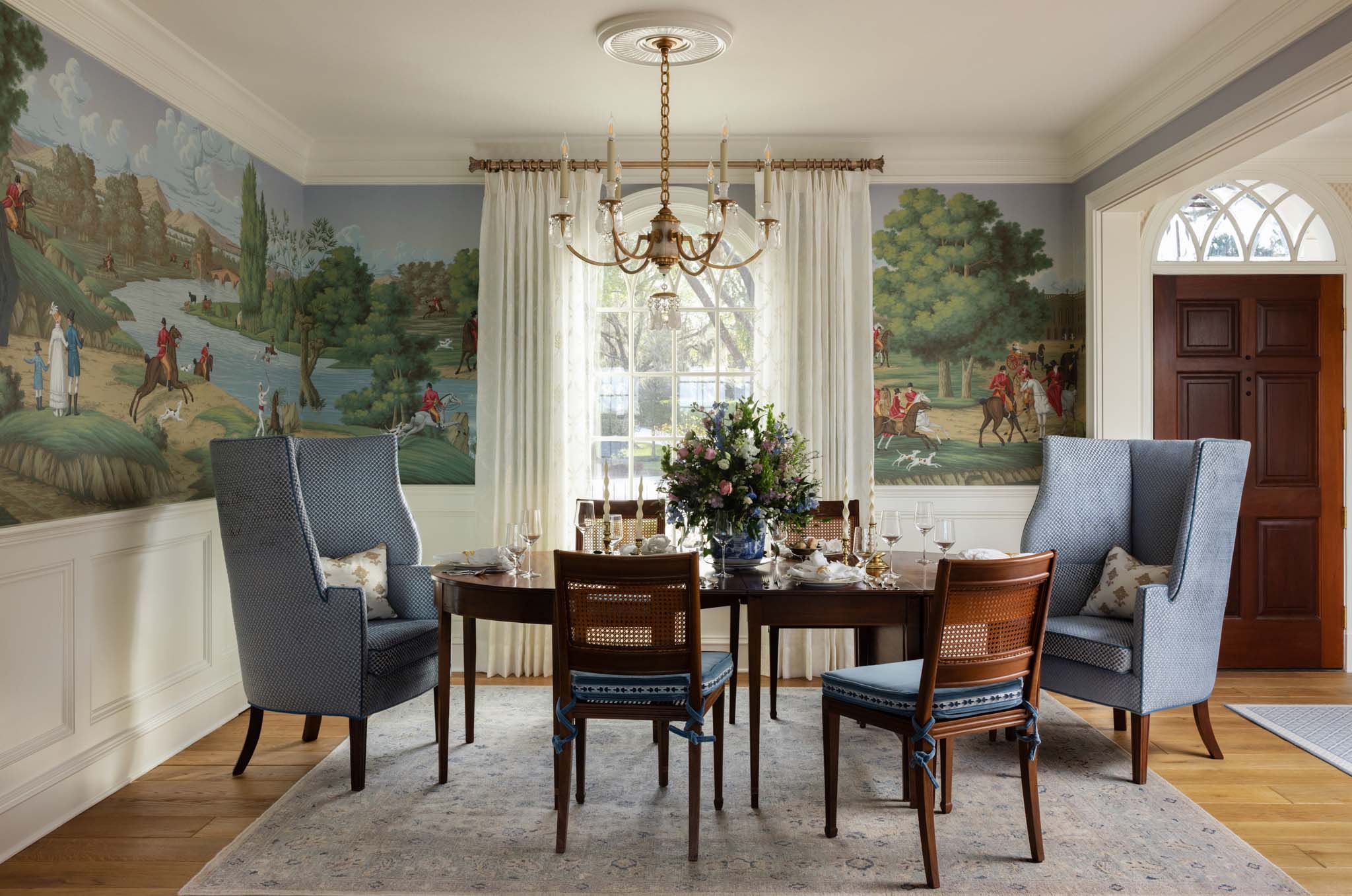 Traditional English country dining room with hand-painted pastoral mural and custom millwork