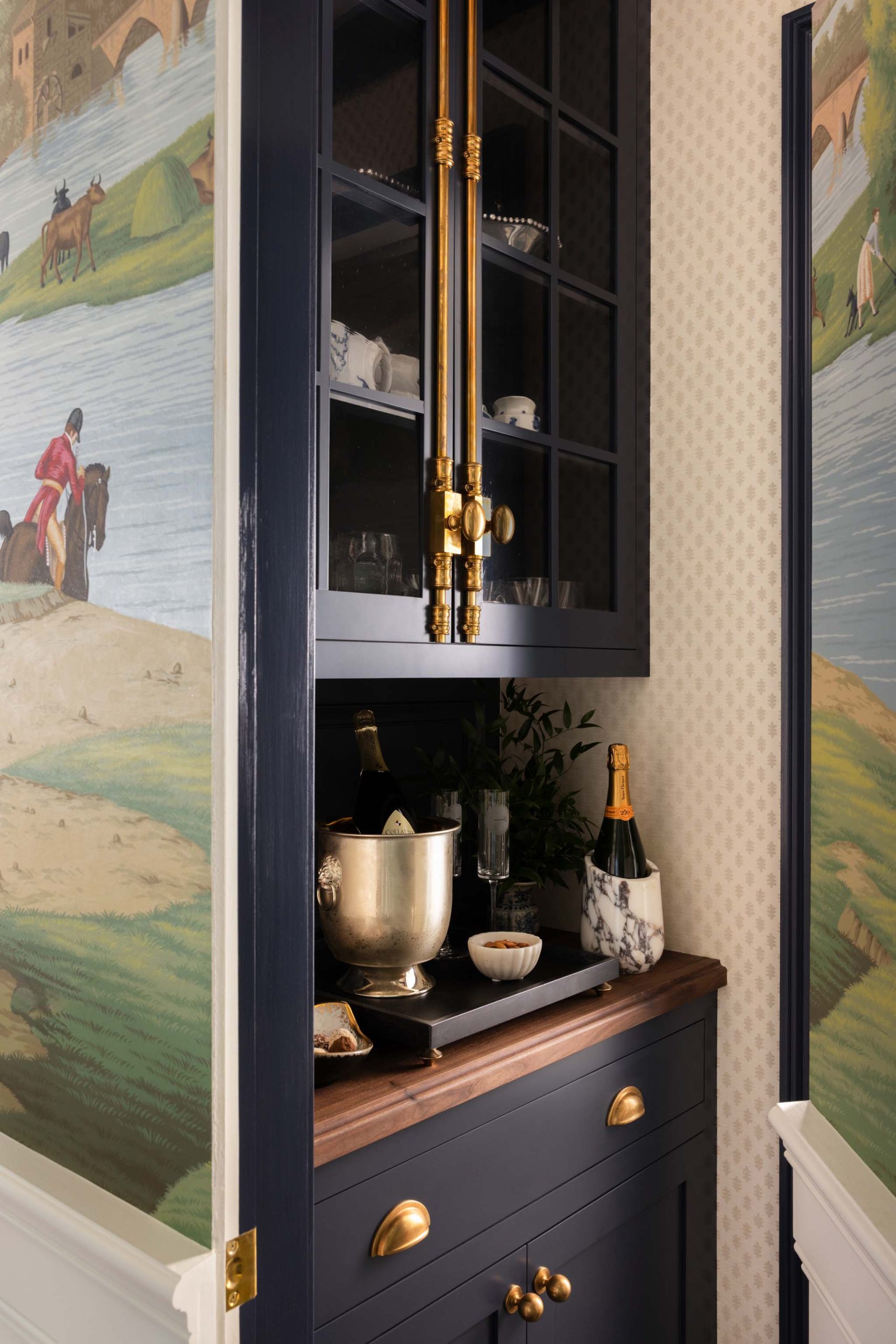 Hidden butler's pantry with custom English cabinetry and cremone bolts